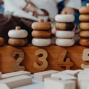 Close-up of wooden number stacking toy promoting creativity and learning in children.